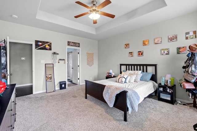 137 Paul Azinger Dr, Round Rock, TX 78664 - bedroom featuring carpet floors, a raised ceiling, and ceiling fan