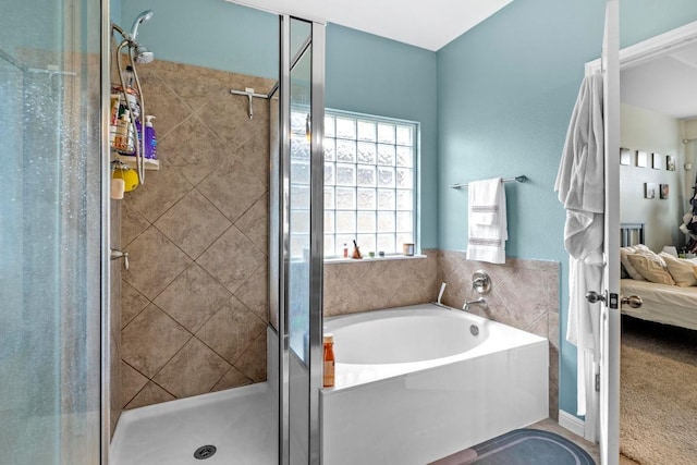 137 Paul Azinger Dr, Round Rock, TX 78664 - full bathroom featuring connected bathroom, a garden tub, and a stall shower