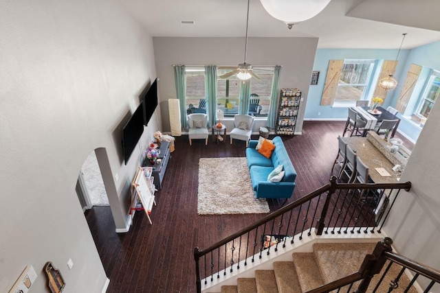 137 Paul Azinger Dr, Round Rock, TX 78664 - living room with wood finished floors, stairs, and a ceiling fan