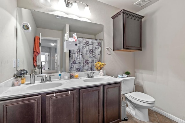 137 Paul Azinger Dr, Round Rock, TX 78664 - full bathroom featuring double vanity and tile patterned floors