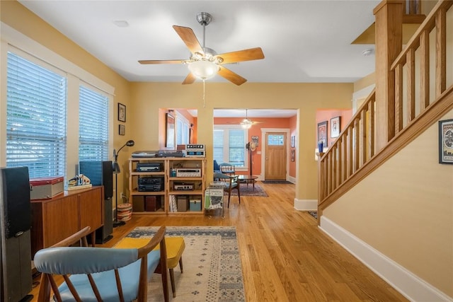 903 E 14th St, Austin, TX 78702 - living area with a ceiling fan, stairway, light wood-type flooring, and an office area