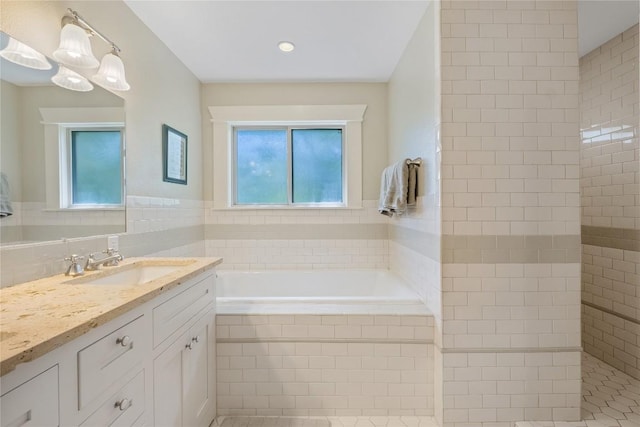 903 E 14th St, Austin, TX 78702 - bathroom featuring vanity, a bath, and tile walls