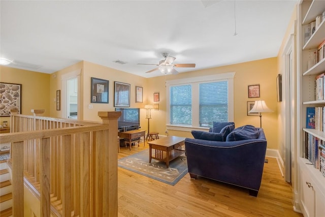 903 E 14th St, Austin, TX 78702 - living room featuring light wood finished floors and ceiling fan