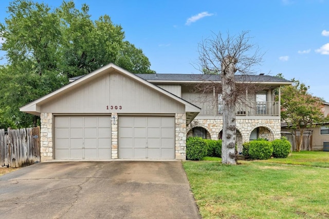 1303 Creekview Dr, Round Rock, TX 78681 - view of front of house with stone siding, a garage, concrete driveway, and a balcony