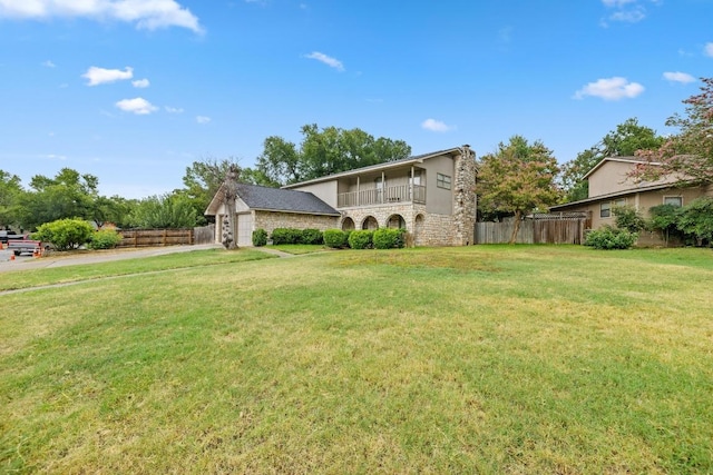 1303 Creekview Dr, Round Rock, TX 78681 - view of front of property with a balcony, stone siding, and an attached garage
