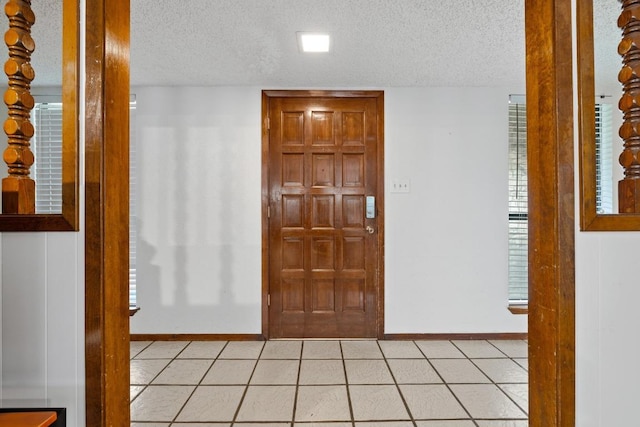 1303 Creekview Dr, Round Rock, TX 78681 - foyer entrance featuring a textured ceiling and light tile patterned floors