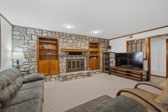 1303 Creekview Dr, Round Rock, TX 78681 - carpeted living area featuring a textured ceiling, a stone fireplace, built in features, and crown molding