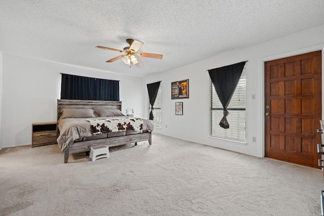 1303 Creekview Dr, Round Rock, TX 78681 - carpeted bedroom with a textured ceiling and a ceiling fan
