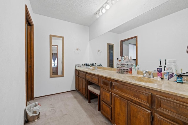 1303 Creekview Dr, Round Rock, TX 78681 - bathroom with double vanity and a textured ceiling