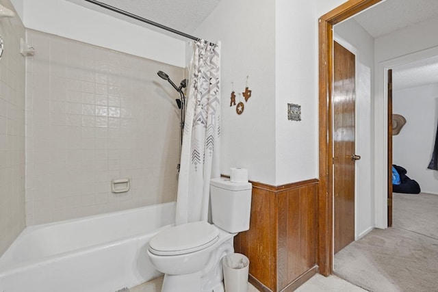 1303 Creekview Dr, Round Rock, TX 78681 - bathroom featuring shower / tub combo, wood walls, and wainscoting
