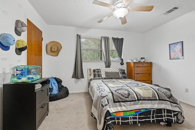1303 Creekview Dr, Round Rock, TX 78681 - carpeted bedroom with a textured ceiling and a ceiling fan