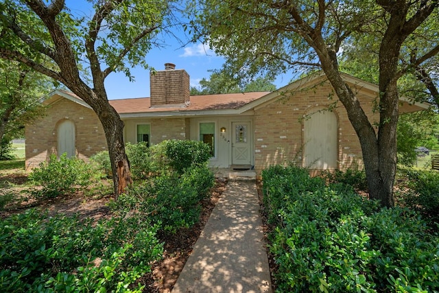 236 Lodestone Cir, Cedar Park, TX 78613 - ranch-style house with brick siding and a chimney