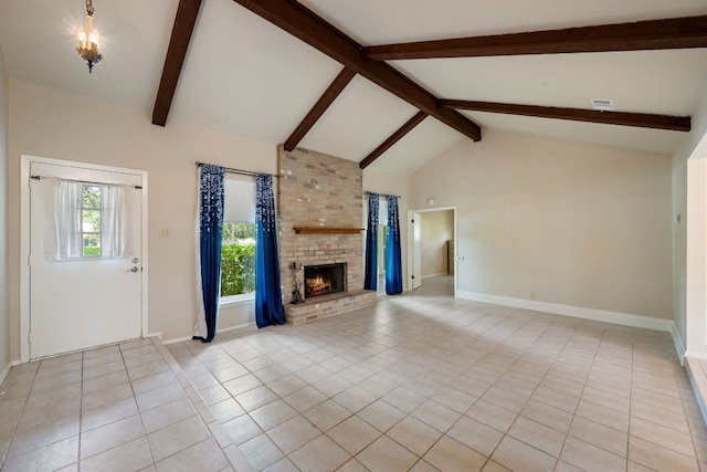 236 Lodestone Cir, Cedar Park, TX 78613 - unfurnished living room featuring light tile patterned floors, beam ceiling, a fireplace, and high vaulted ceiling