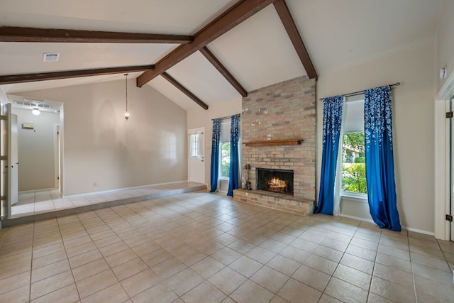 236 Lodestone Cir, Cedar Park, TX 78613 - unfurnished living room with tile patterned floors, beam ceiling, a brick fireplace, and high vaulted ceiling