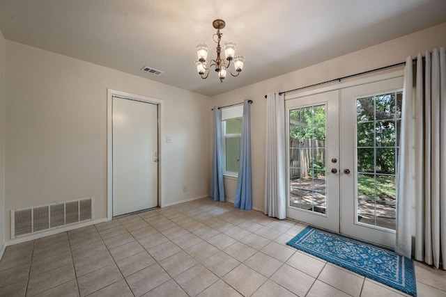 236 Lodestone Cir, Cedar Park, TX 78613 - unfurnished dining area featuring french doors, a chandelier, and light tile patterned floors