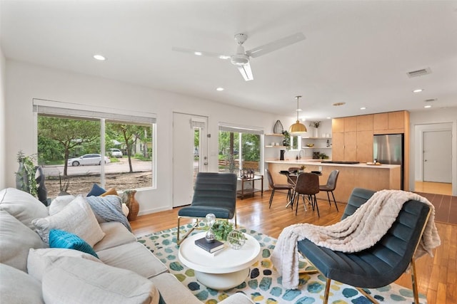 5507 Duval St Unit A, Austin, TX 78751 - living area featuring light wood-style flooring, a ceiling fan, and recessed lighting