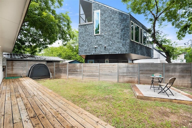 5507 Duval St Unit A, Austin, TX 78751 - fenced backyard with a wooden deck and a patio