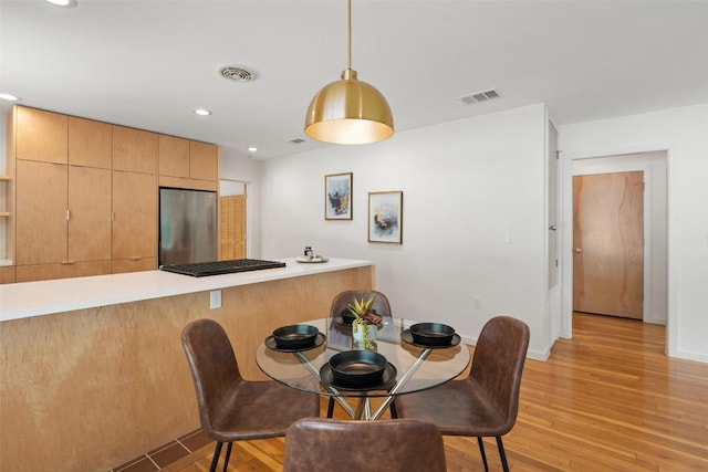 5507 Duval St Unit A, Austin, TX 78751 - dining space featuring light wood-type flooring and recessed lighting