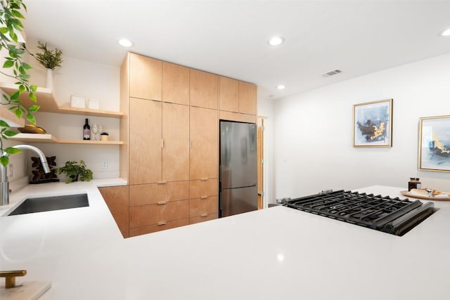 5507 Duval St Unit A, Austin, TX 78751 - kitchen with freestanding refrigerator, light brown cabinets, light countertops, open shelves, and stovetop
