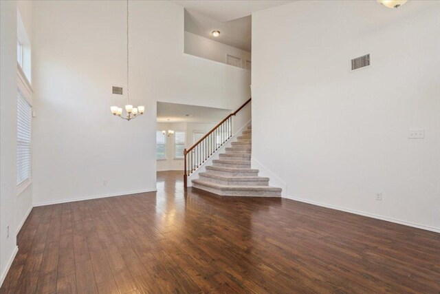 3211 Malmaison Rd, Killeen, TX 76542 - entryway featuring a chandelier, wood finished floors, and stairway