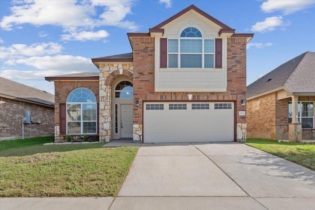 3211 Malmaison Rd, Killeen, TX 76542 - traditional home with an attached garage, driveway, a front yard, and stone siding