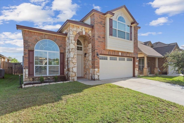 3211 Malmaison Rd, Killeen, TX 76542 - view of front of house featuring a garage, concrete driveway, stone siding, and brick siding
