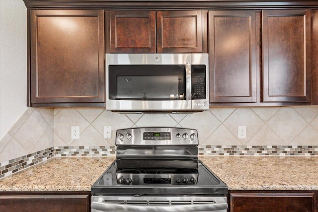 3211 Malmaison Rd, Killeen, TX 76542 - kitchen with appliances with stainless steel finishes and dark brown cabinets