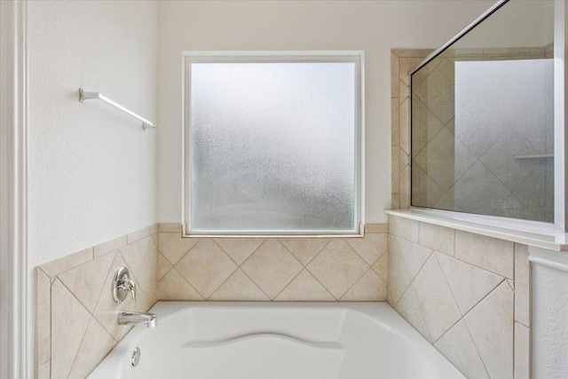 3211 Malmaison Rd, Killeen, TX 76542 - bathroom with healthy amount of natural light and a garden tub