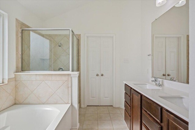 3211 Malmaison Rd, Killeen, TX 76542 - bathroom with a garden tub, a shower stall, double vanity, tile patterned flooring, and a closet