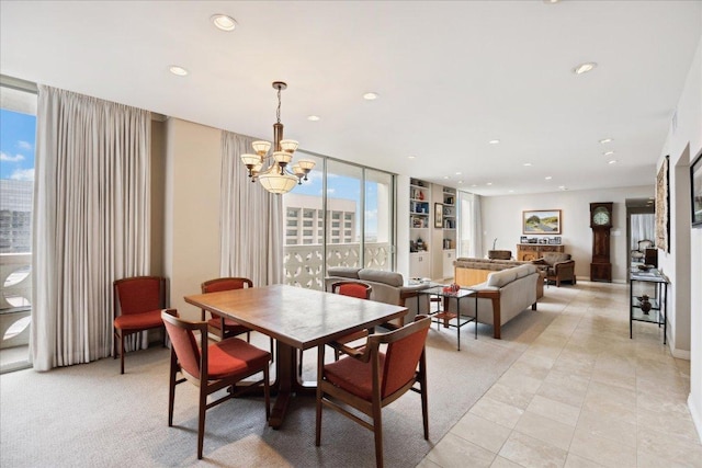 1801 Lavaca St Unit 9J, Austin, TX 78701 - dining area featuring recessed lighting, a chandelier, and light tile patterned floors