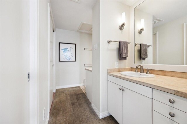 1801 Lavaca St Unit 9J, Austin, TX 78701 - bathroom with vanity and baseboards