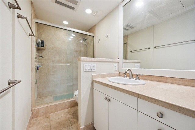 1801 Lavaca St Unit 9J, Austin, TX 78701 - bathroom with vanity, a stall shower, recessed lighting, and tile patterned floors
