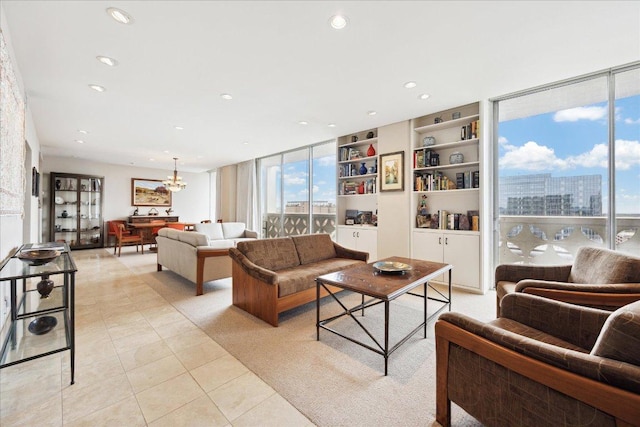 1801 Lavaca St Unit 9J, Austin, TX 78701 - living area featuring a chandelier, light tile patterned floors, recessed lighting, built in shelves, and a city view