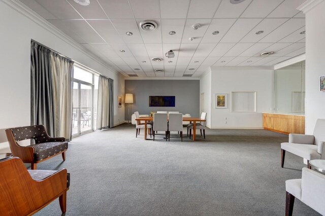 1801 Lavaca St Unit 9J, Austin, TX 78701 - living area featuring carpet, ornamental molding, and a paneled ceiling