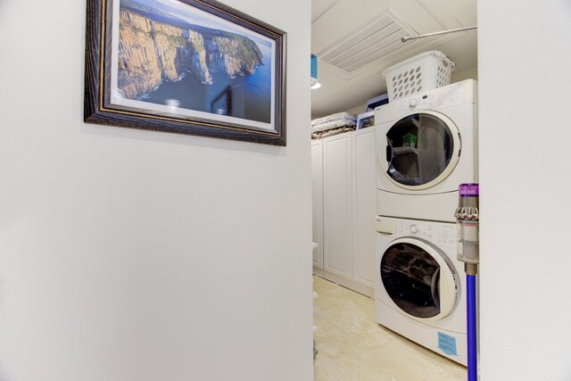 1801 Lavaca St Unit 9J, Austin, TX 78701 - washroom featuring estacked washer and dryer
