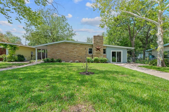 2609 Ellise Ave, Austin, TX 78757 - mid-century home with a chimney and stone siding