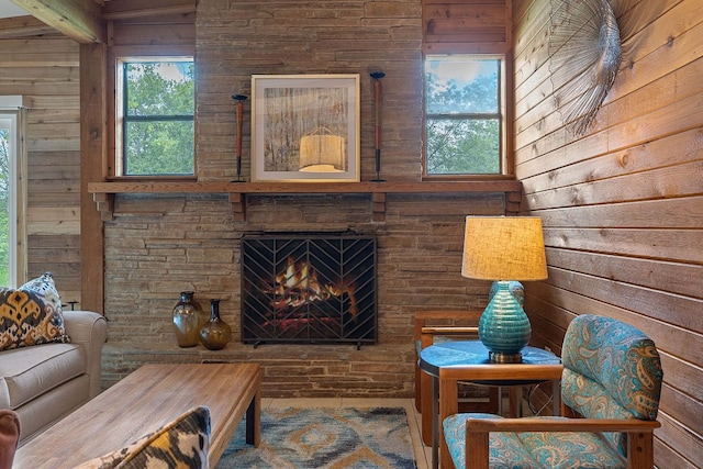 2609 Ellise Ave, Austin, TX 78757 - living area with wooden walls, plenty of natural light, and a fireplace