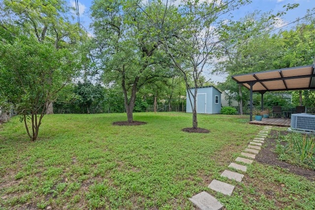 2609 Ellise Ave, Austin, TX 78757 - view of grassy yard featuring a shed and a deck