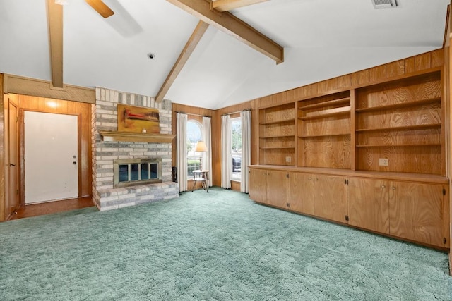 1411 Shenandoah Dr, Cedar Park, TX 78613 - unfurnished living room with carpet flooring, a fireplace, ceiling fan, and wooden walls
