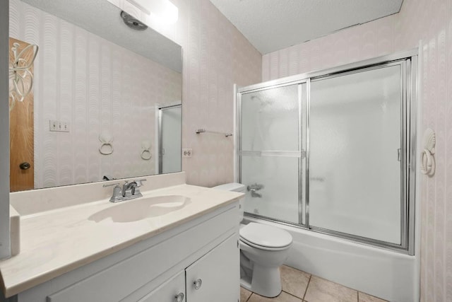 1411 Shenandoah Dr, Cedar Park, TX 78613 - full bathroom featuring wallpapered walls, vanity, shower / bath combination with glass door, and tile patterned flooring