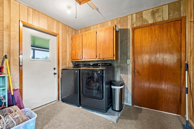 1411 Shenandoah Dr, Cedar Park, TX 78613 - laundry area with cabinet space, separate washer and dryer, carpet, and wood walls