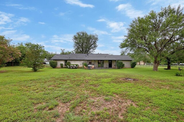 1411 Shenandoah Dr, Cedar Park, TX 78613 - rear view of property with a lawn
