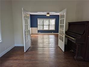 308 Taylor Rd, Elgin, TX 78621 - unfurnished living room featuring wood finished floors, healthy amount of natural light, ceiling fan, and french doors