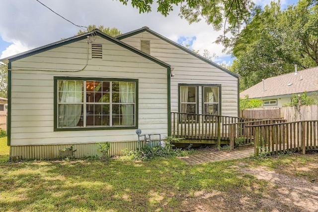 5605 Tura Ln, Austin, TX 78721 - back of house with a wooden deck