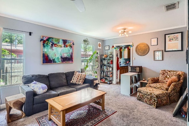 5605 Tura Ln, Austin, TX 78721 - carpeted living room with healthy amount of natural light and ornamental molding