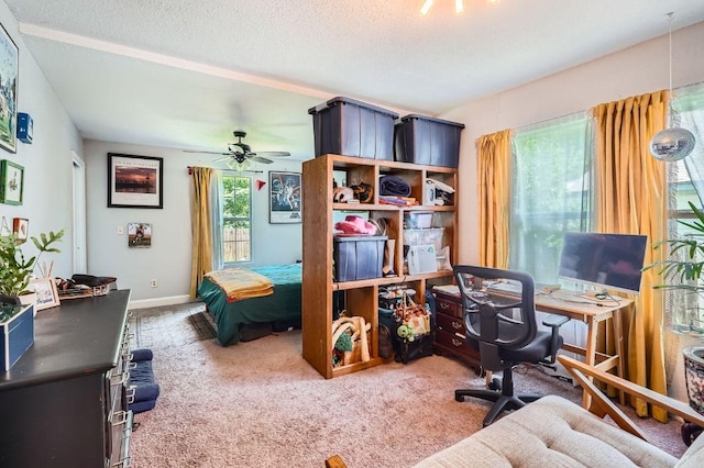 5605 Tura Ln, Austin, TX 78721 - bedroom featuring carpet floors, a desk, and a textured ceiling