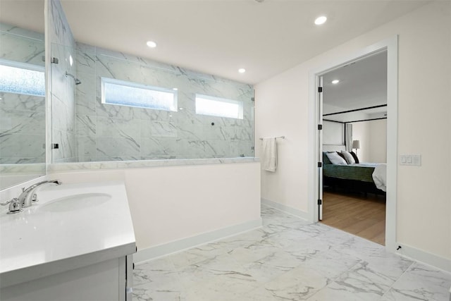 8405 Ambergill Ct, Austin, TX 78744 - ensuite bathroom featuring a marble finish shower, vanity, recessed lighting, and marble finish flooring