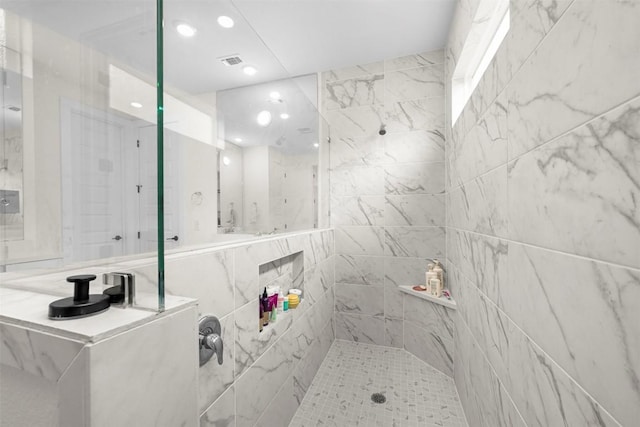 8405 Ambergill Ct, Austin, TX 78744 - bathroom featuring a tile shower and recessed lighting