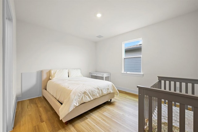 8405 Ambergill Ct, Austin, TX 78744 - bedroom with light wood-style flooring and recessed lighting