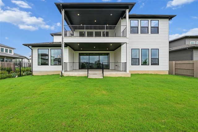 8405 Ambergill Ct, Austin, TX 78744 - rear view of house with a balcony and a fenced backyard